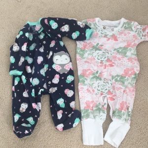 Set of two one piece baby girl outfits.